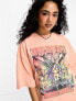 ASOS DESIGN oversized t-shirt with festival graphic in pink