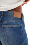 Weekday Ample low waist baggy fit jeans in streaky blue wash