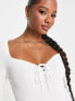 ASOS DESIGN Petite knitted top with sweetheart neck and lace up front detail in white