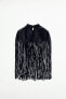 Short leather cape with fringing