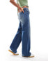 Monki Imoo low waisted wide fit jeans in gabby blue wash with spray