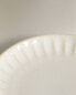 Stoneware side plate with raised design