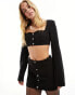 Kyo The Brand mini skirt with diamante button detail co-ord in black