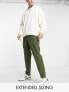 ASOS DESIGN tapered cord trousers with busted seams in green