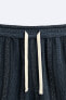 Striped textured bermuda shorts