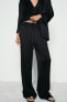 CREASED-EFFECT WIDE-LEG TROUSERS