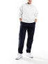 Фото #1 товара Tommy Hilfiger Tapered Chinos in Dark Blue