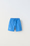 Plush bermuda shorts with label detail