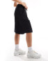 COLLUSION extreme longline short in black