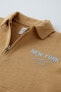 Quarter-zip polo sweatshirt with raised slogan