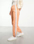 Фото #1 товара Aape By A Bathing Ape college parachute trousers in orange