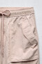 Faded-effect cargo trousers