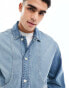 ASOS DESIGN classic fit denim jacket with panelled detail front pockets in washed blue