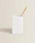 White earthenware toothbrush holder