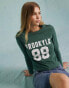 Фото #2 товара Miss Selfridge Brooklyn graphic long sleeve t-shirt in washed green