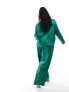 Flounce London Plus satin floaty trousers in emerald green co ord