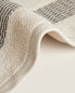 Cotton towel with pleated border