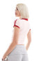 Motel – Isda – Knapp geschnittenes Poloshirt in Rosa mit Schleifenmotiv XS - EU36 - фото #4