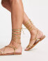 London Rebel – Flache Riemchensandalen in Metallic-Gold mit Beinschnürung