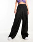 Nicce alia wide leg cargo trousers in black with side hem split