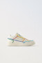 Minimalist lace-up sneakers with multicoloured trim