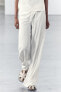 Rustic fabric asymmetric trousers