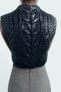 Metallic cable-knit vest