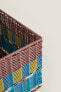 Multicoloured plaited basket lid