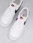 Nike Blazer Low Platform trainers in white and black