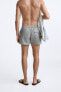 Check-texture swimming trunks