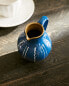 Striped ceramic milk jug