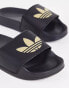 Фото #2 товара adidas Originals Adilette lite sliders in black with gold trefoil