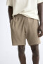 Textured mesh bermuda shorts