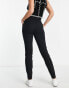 Vero Moda Tall paperbag tie waist tapered trousers in black