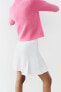 Box pleat knit mini skirt