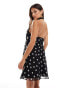 ASOS DESIGN chiffon halter mini dress with corsage detail in mixed spot print