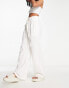 Фото #8 товара In The Style high waist wide leg palazzo trouser in white