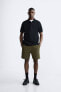 Textured bermuda shorts with label