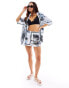 Фото #1 товара ASOS DESIGN satin co-ord short in newspaper print