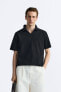Knit polo shirt with opening