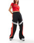 Фото #1 товара Nike Streetwear woven trackpant in black and red