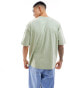 Фото #2 товара ASOS DESIGN oversized t-shirt with front pocket in washed green