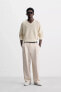 RELAXED FIT PLEATED TROUSERS