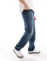 ASOS DESIGN straight leg jeans with stretch in mid wash blue