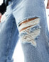 Фото #2 товара ASOS DESIGN baggy jeans with with rips in mid wash blue