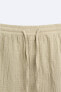 Creased-effect bermuda shorts