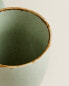 Porcelain mug with antique finish rim