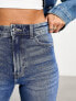 Фото #2 товара Bershka split hem high waisted jeans in mid blue wash