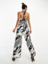 Фото #2 товара River Island halterneck tie back wide leg jumpsuit in black and white