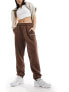 New Balance Linear heritage brushed back fleece sweatpant in brown